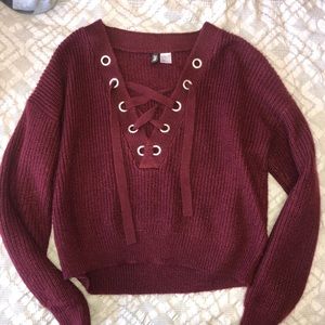 Very cute maroon shirt with crossing on the V neck